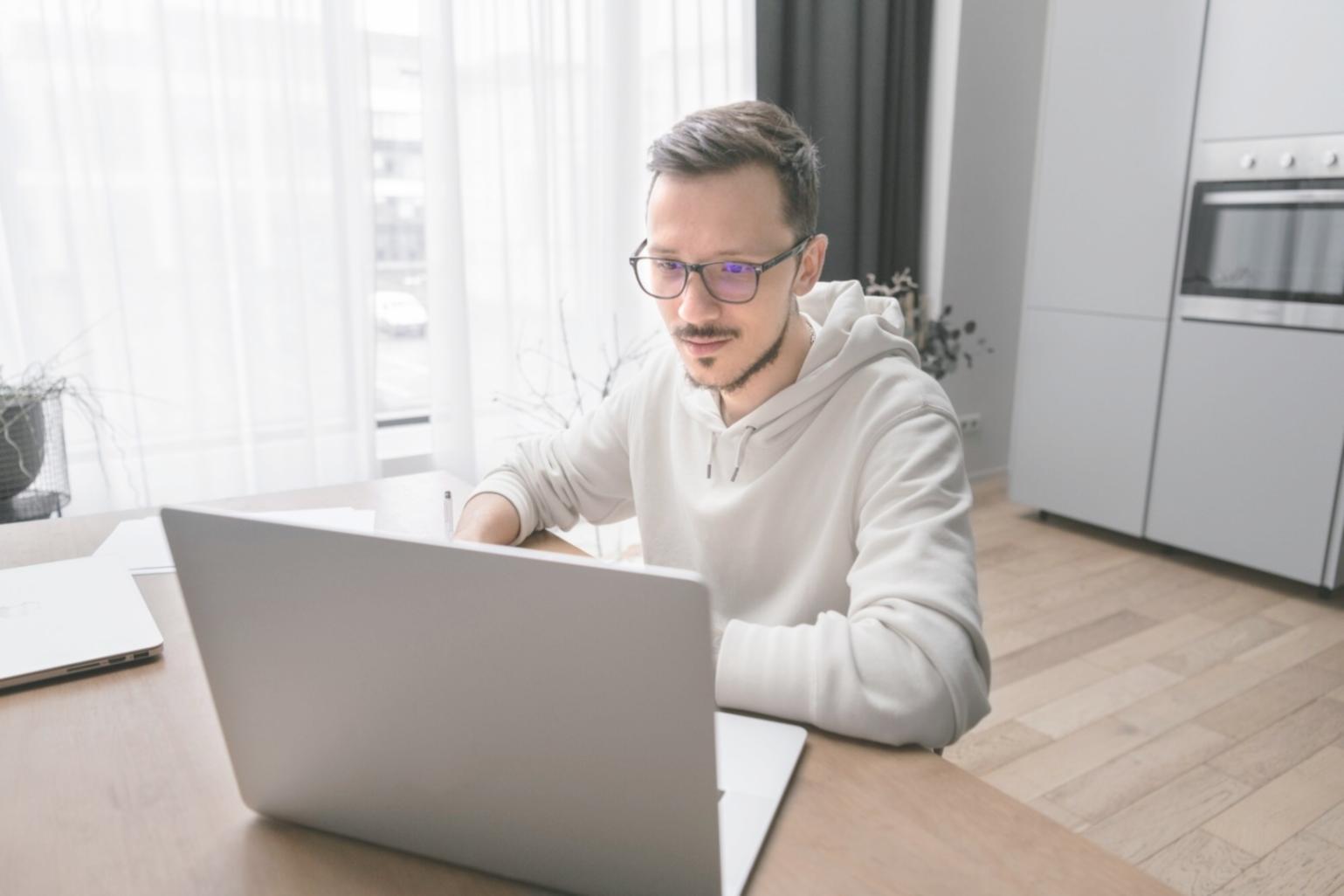 Trader analyzing financial charts in a modern office setting